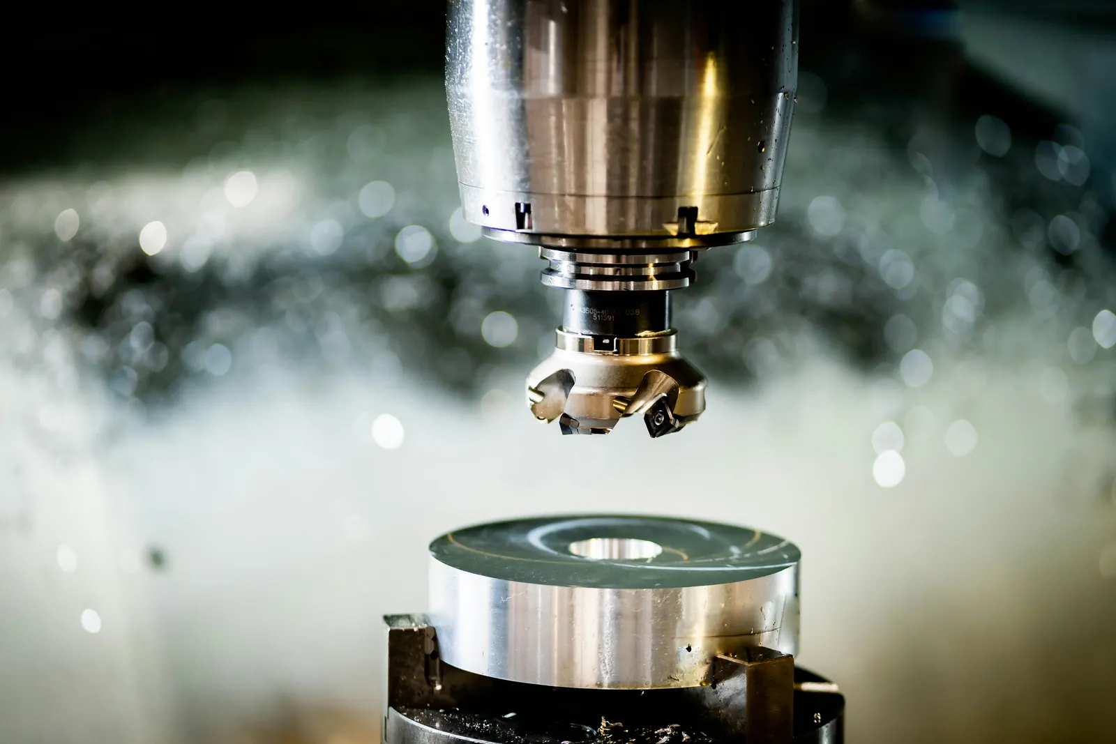 CNC milling machine cutting a metal part